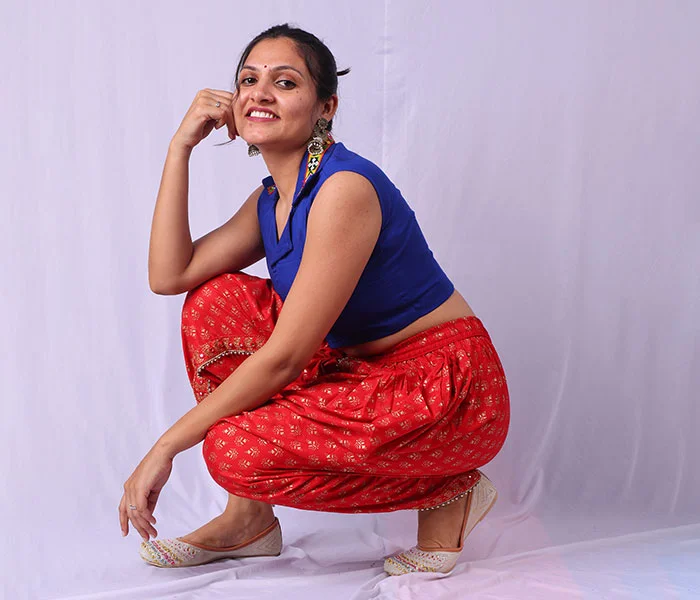 Woman in red saree before professional photo retouching