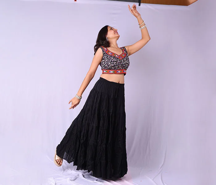 Woman in black dress before professional photo retouching