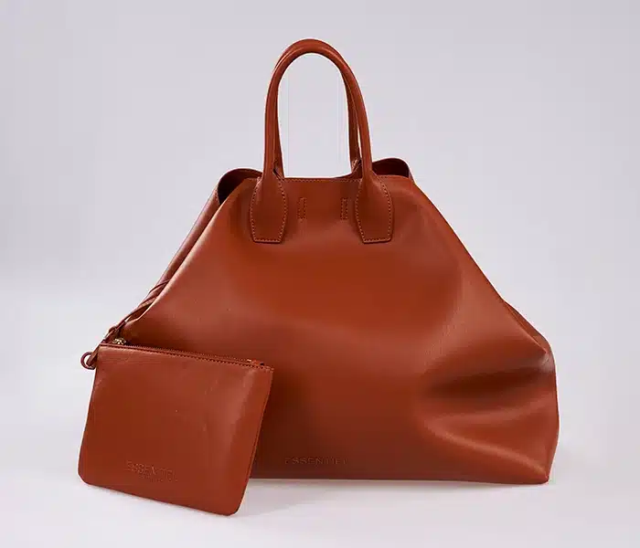 Brown leather handbag before background removal