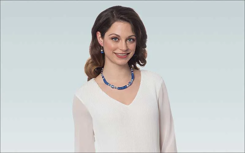 Woman in white top professionally retouched
